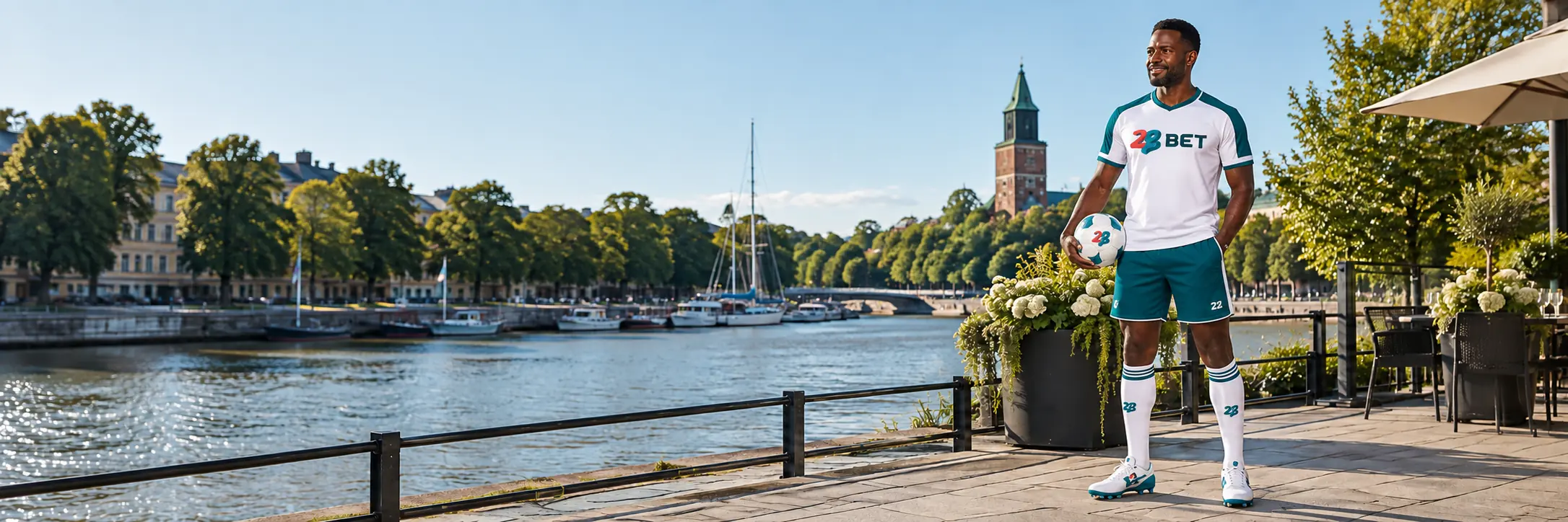 Football player beside the Turku waterfront wearing 22BET branding