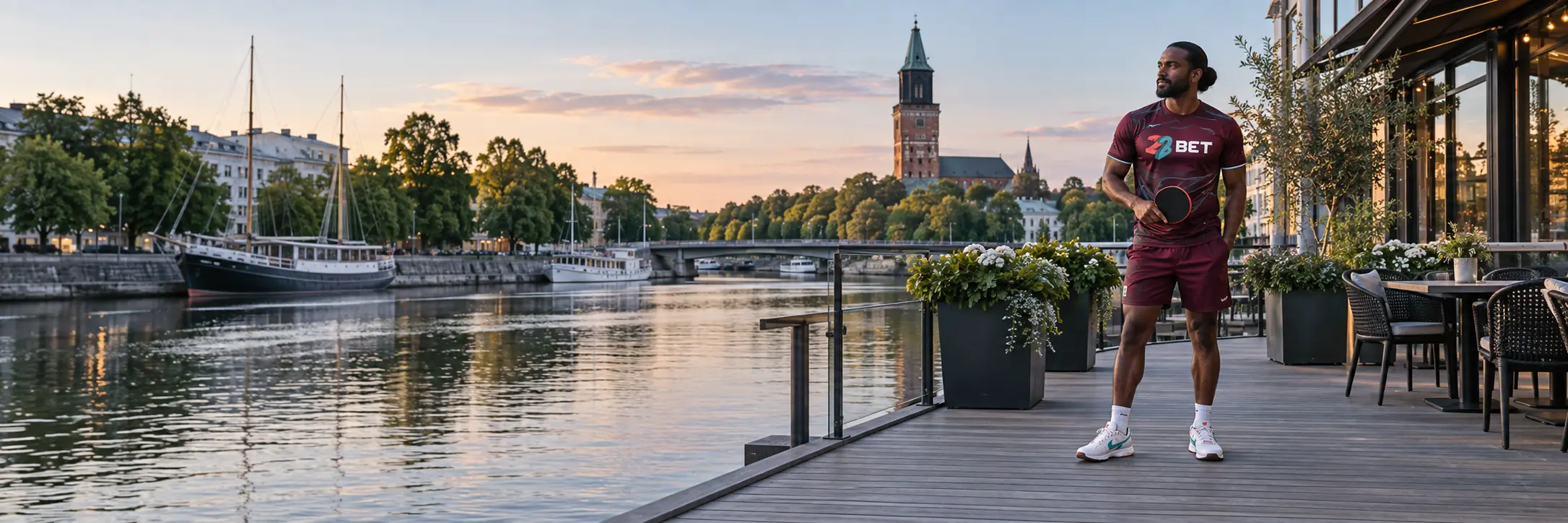 Football player beside the Turku waterfront wearing 22BET branding
